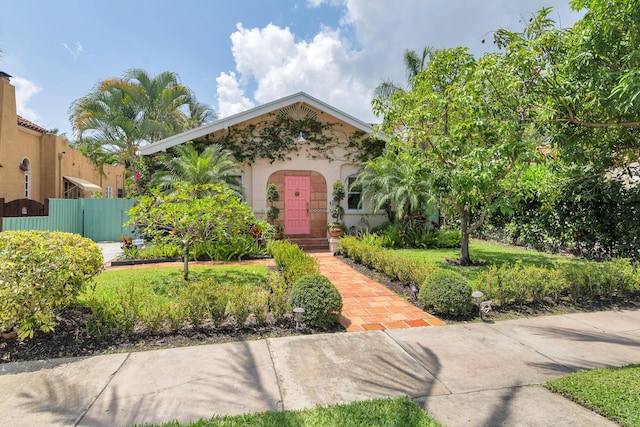 426 30th St, West Palm Beach, FL 33407 - view of front of house featuring stucco siding, fence, and a gate