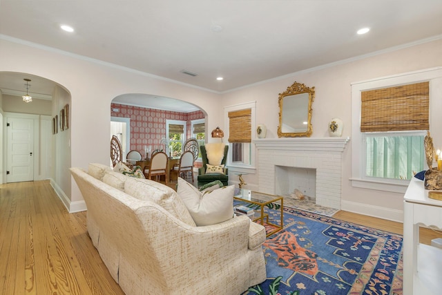 426 30th St, West Palm Beach, FL 33407 - living area featuring wallpapered walls, baseboards, hardwood / wood-style floors, and crown molding