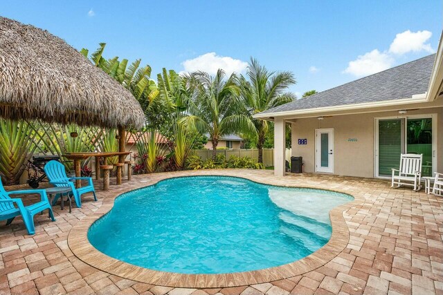 2999 Dovedale Ct, Wellington, FL 33414 - view of swimming pool featuring fence, a fenced in pool, outdoor dry bar, and a patio area