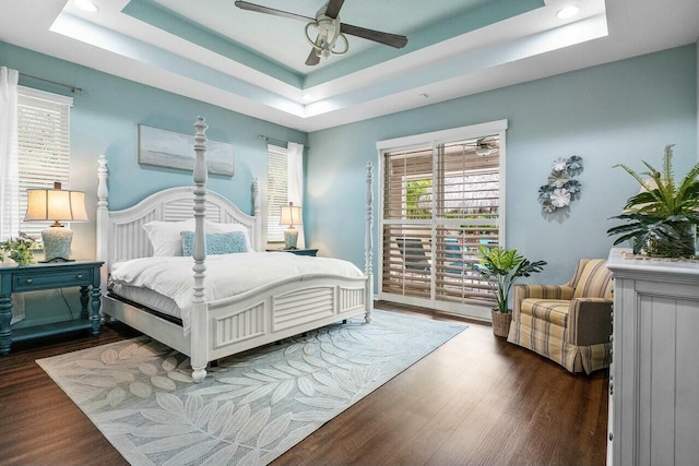 2999 Dovedale Ct, Wellington, FL 33414 - bedroom with a tray ceiling, access to exterior, and wood finished floors