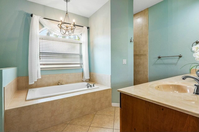 2999 Dovedale Ct, Wellington, FL 33414 - bathroom featuring tile patterned flooring, a chandelier, a sink, a garden tub, and double vanity