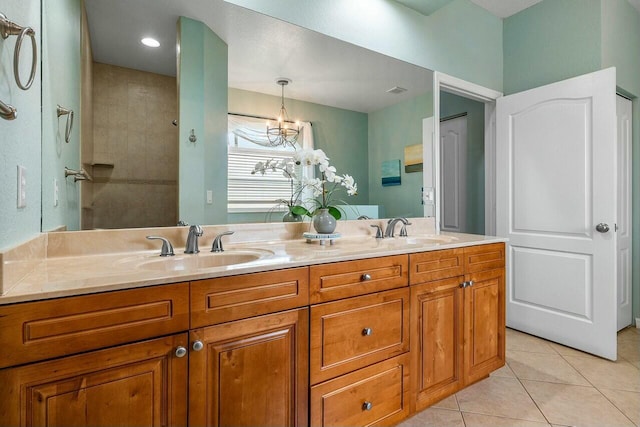 2999 Dovedale Ct, Wellington, FL 33414 - full bathroom featuring double vanity, a sink, tile patterned floors, and a chandelier