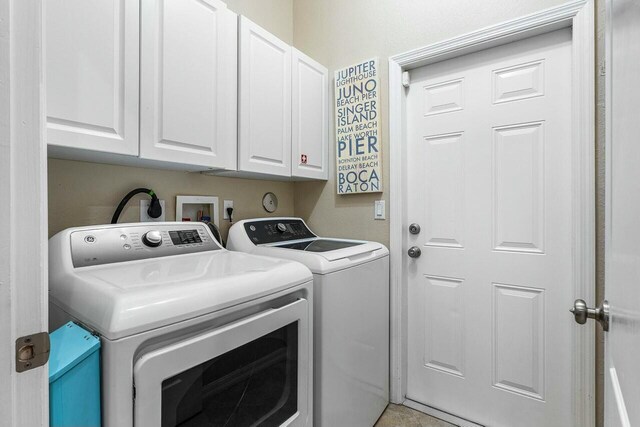 2999 Dovedale Ct, Wellington, FL 33414 - clothes washing area featuring washer and clothes dryer and cabinet space