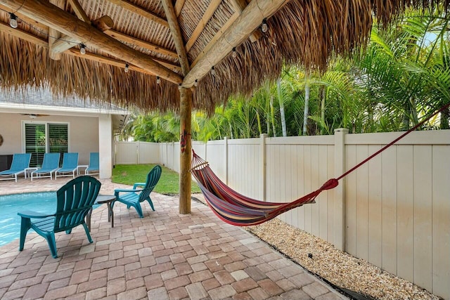 2999 Dovedale Ct, Wellington, FL 33414 - view of patio / terrace featuring a fenced in pool, a fenced backyard, and a gazebo