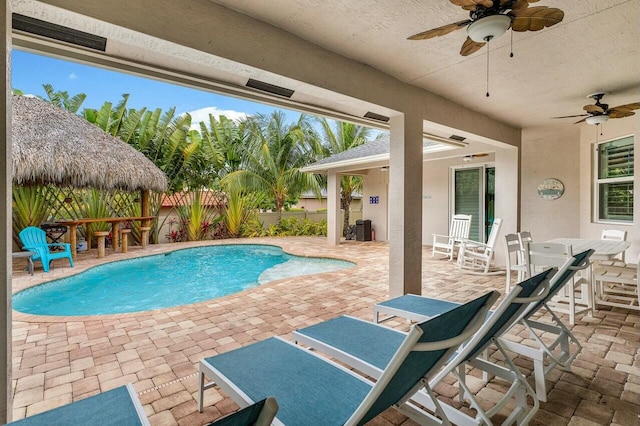 2999 Dovedale Ct, Wellington, FL 33414 - view of swimming pool with a ceiling fan, a fenced in pool, fence, and a patio area