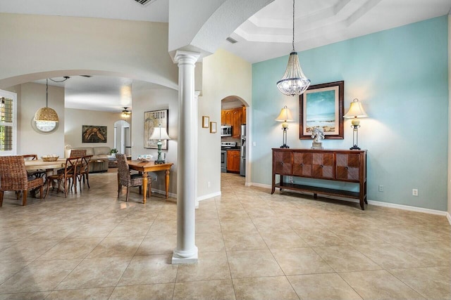 2999 Dovedale Ct, Wellington, FL 33414 - foyer with baseboards, arched walkways, light tile patterned flooring, and a ceiling fan