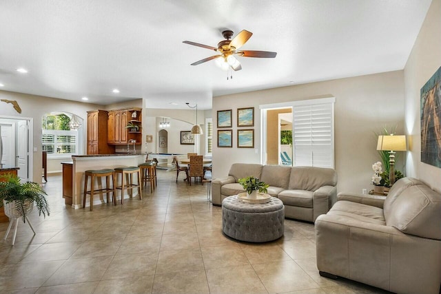 2999 Dovedale Ct, Wellington, FL 33414 - living area with light tile patterned flooring, arched walkways, recessed lighting, and a ceiling fan