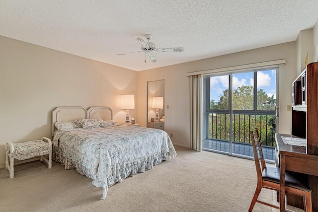 bedroom featuring a textured ceiling, access to exterior, a ceiling fan, and light colored carpet