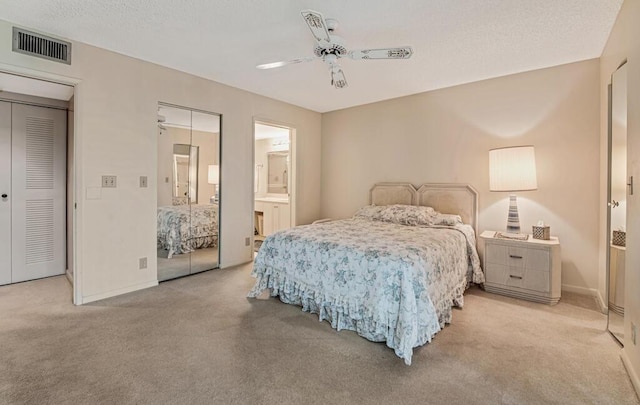bedroom with light colored carpet, visible vents, ceiling fan, and baseboards