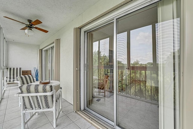 balcony featuring a ceiling fan
