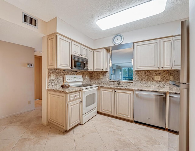 kitchen with white electric range oven, a sink, visible vents, dishwasher, and black microwave