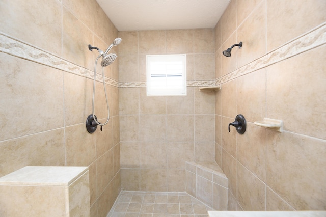 full bath featuring a tile shower