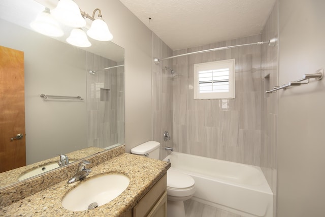 bathroom featuring toilet, vanity, shower / bathtub combination, and a textured ceiling