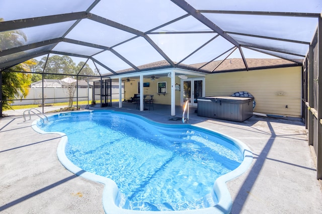 view of swimming pool with a fenced backyard, a ceiling fan, a hot tub, french doors, and a patio area