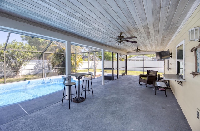 sunroom with a ceiling fan