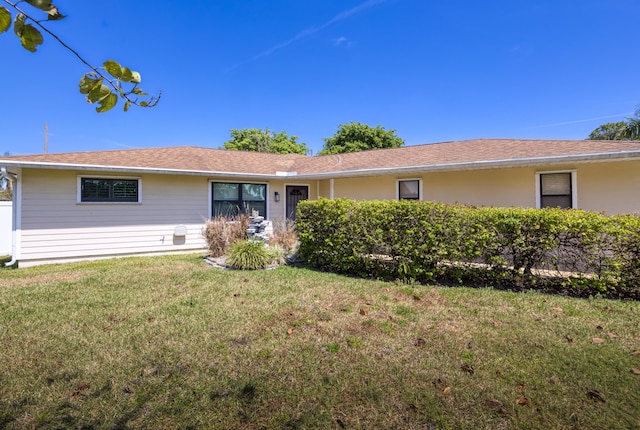 ranch-style home with a front yard
