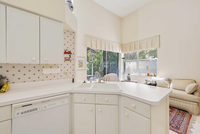 2502 NW 66th Dr, Boca Raton, FL 33496 - kitchen featuring a sink, open floor plan, white cabinets, white dishwasher, and light countertops