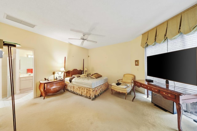2502 NW 66th Dr, Boca Raton, FL 33496 - bedroom featuring visible vents, light carpet, ensuite bath, and ceiling fan