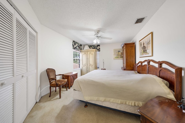 2502 NW 66th Dr, Boca Raton, FL 33496 - bedroom featuring visible vents, light carpet, a closet, a textured ceiling, and a ceiling fan