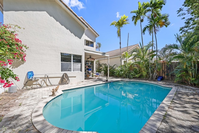 2502 NW 66th Dr, Boca Raton, FL 33496 - view of pool featuring a ceiling fan, a patio, fence, and a fenced in pool