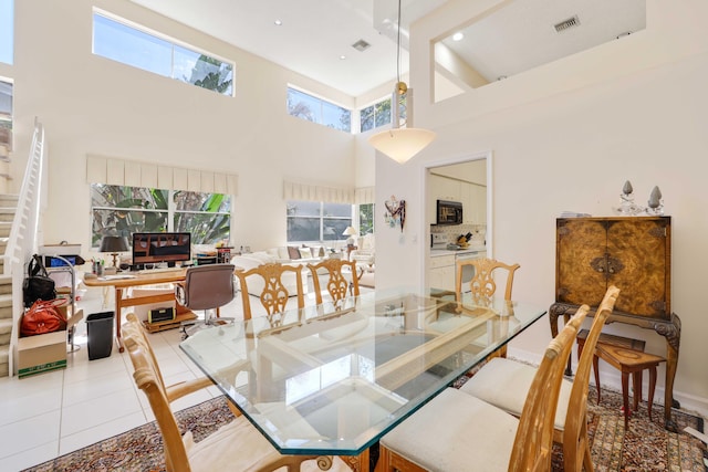 2502 NW 66th Dr, Boca Raton, FL 33496 - tiled dining space with visible vents, recessed lighting, a skylight, and stairs