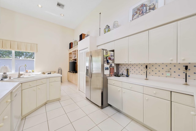 2502 NW 66th Dr, Boca Raton, FL 33496 - kitchen with visible vents, dishwasher, light countertops, stainless steel fridge, and a sink