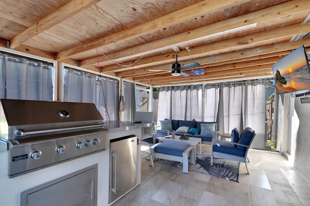 view of patio / terrace featuring exterior kitchen, area for grilling, fence, and an outdoor hangout area