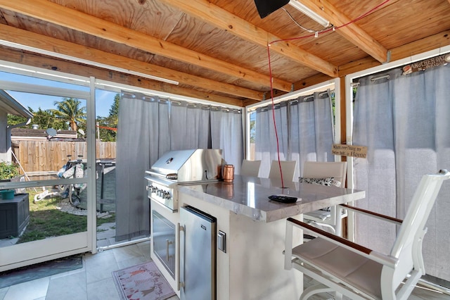 interior space featuring area for grilling, fence, and grilling area