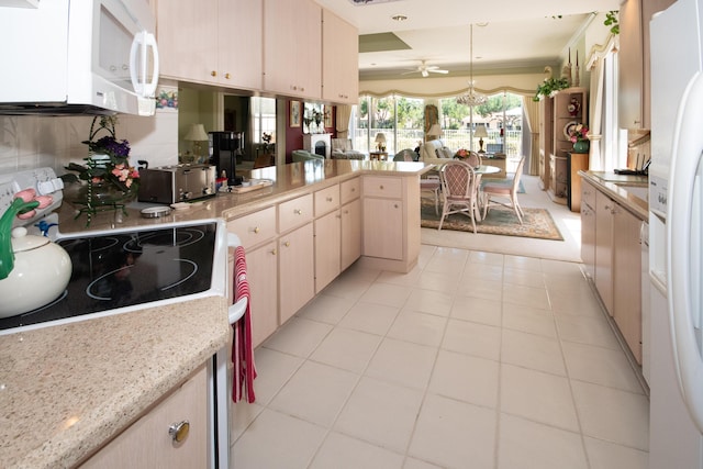 kitchen featuring a peninsula, white appliances, ceiling fan, decorative light fixtures, and light tile patterned floors