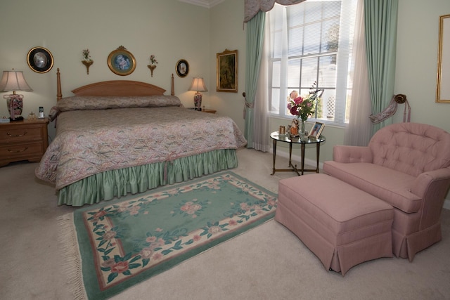 carpeted bedroom featuring crown molding