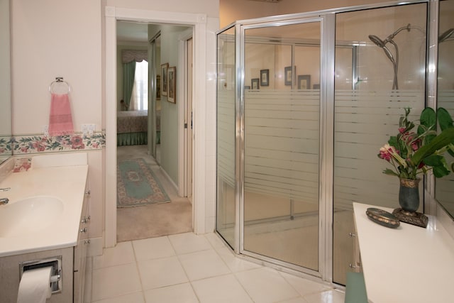 bathroom featuring a shower stall, tile patterned floors, vanity, and connected bathroom