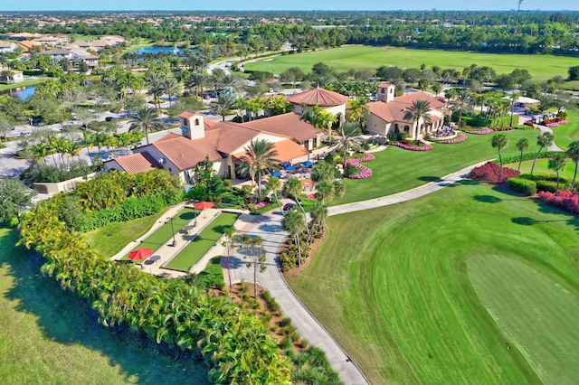bird's eye view with view of golf course, a water view, and a residential view