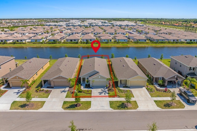 12164 SW Rimini Way, Port Saint Lucie, FL 34987 - aerial perspective of suburban area with a large body of water