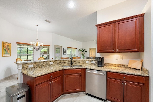 5879 NW Leah Dr, Port Saint Lucie, FL 34986 - kitchen with dishwasher, a sink, a peninsula, a chandelier, and light stone countertops