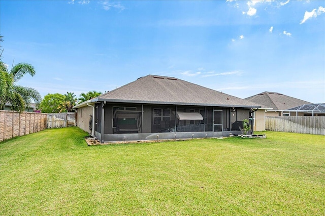 5879 NW Leah Dr, Port Saint Lucie, FL 34986 - rear view of property featuring a sunroom and roof with shingles
