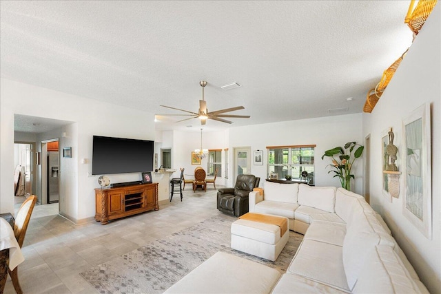 5879 NW Leah Dr, Port Saint Lucie, FL 34986 - living area with a textured ceiling and a ceiling fan