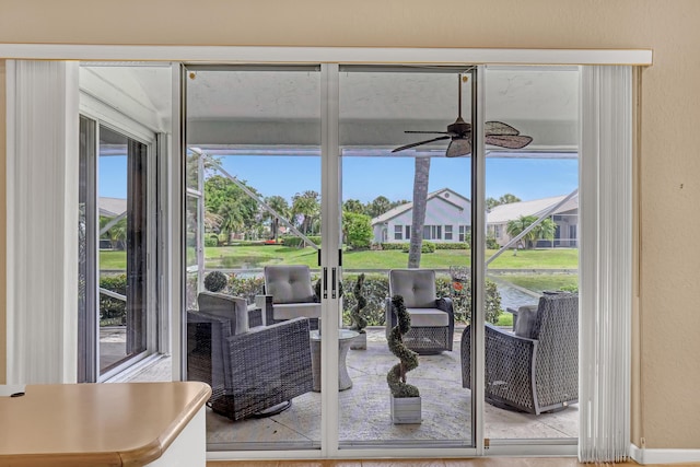 6308 Crystal View Ln, Boynton Beach, FL 33437 - doorway to outside with ceiling fan and a water view