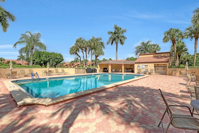 6308 Crystal View Ln, Boynton Beach, FL 33437 - community pool featuring a patio and fence