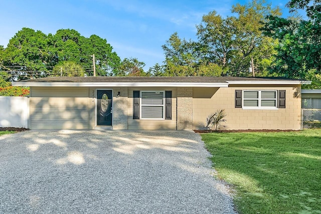 2244 Cooks Ct, Vero Beach, FL 32962 - ranch-style house with concrete block siding and driveway