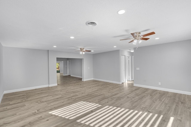 2244 Cooks Ct, Vero Beach, FL 32962 - unfurnished living room featuring a ceiling fan, recessed lighting, baseboards, and light wood-style flooring