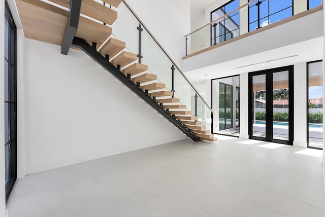 880 NE 3rd Ave, Boca Raton, FL 33432 - foyer featuring a towering ceiling and stairs
