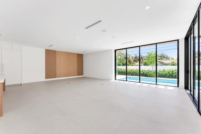 880 NE 3rd Ave, Boca Raton, FL 33432 - spare room with a wall of windows and plenty of natural light