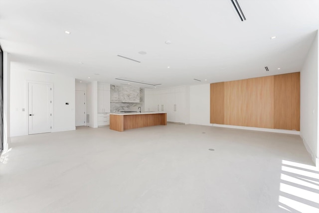 880 NE 3rd Ave, Boca Raton, FL 33432 - unfurnished living room with finished concrete flooring