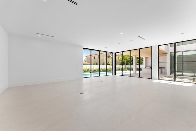 880 NE 3rd Ave, Boca Raton, FL 33432 - unfurnished room featuring a wall of windows