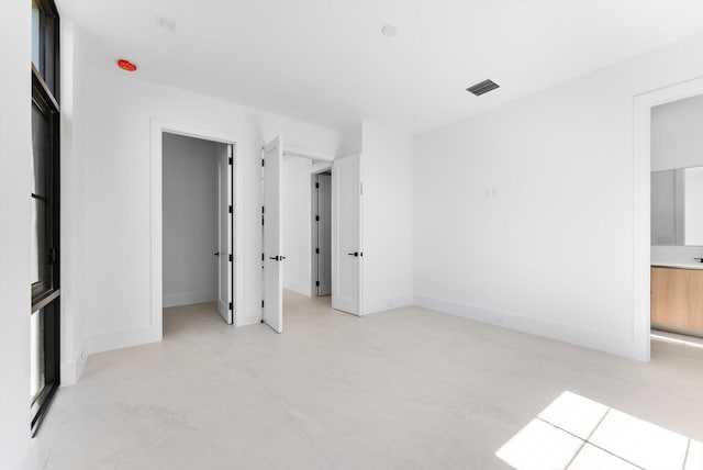 880 NE 3rd Ave, Boca Raton, FL 33432 - unfurnished bedroom featuring concrete flooring and baseboards