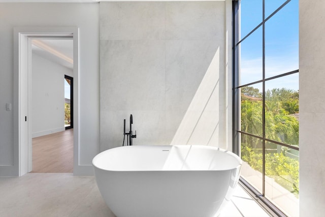880 NE 3rd Ave, Boca Raton, FL 33432 - bathroom featuring a freestanding bath
