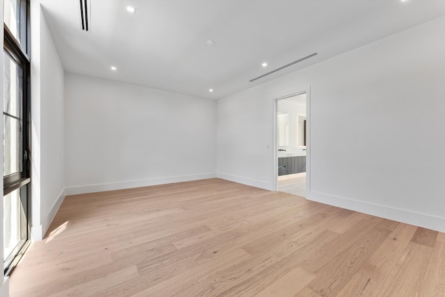 880 NE 3rd Ave, Boca Raton, FL 33432 - spare room with light wood finished floors, recessed lighting, and baseboards