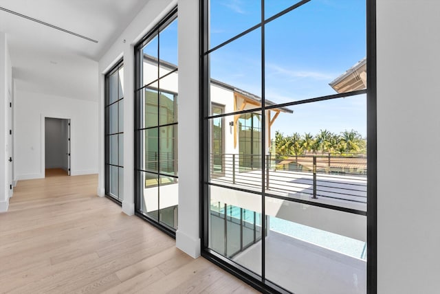880 NE 3rd Ave, Boca Raton, FL 33432 - entryway with light wood-style floors and baseboards