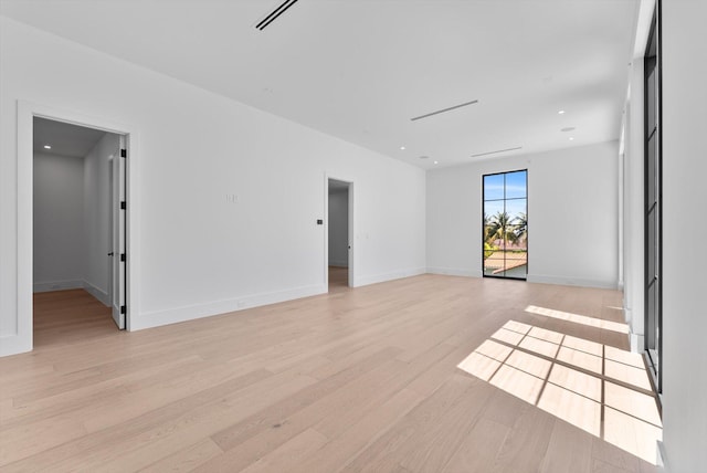880 NE 3rd Ave, Boca Raton, FL 33432 - unfurnished room featuring light wood-type flooring, baseboards, and recessed lighting