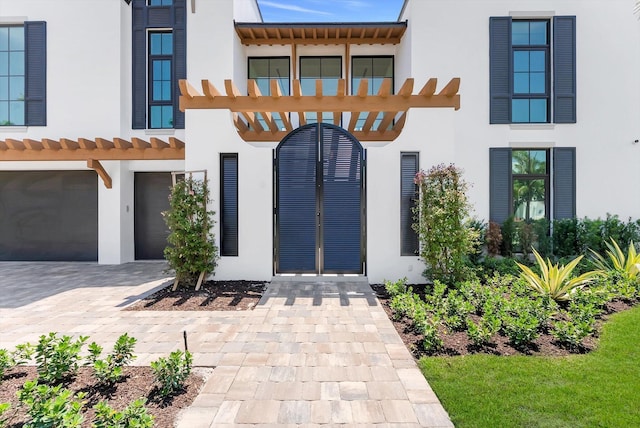880 NE 3rd Ave, Boca Raton, FL 33432 - view of front of house featuring stucco siding, a garage, a tile roof, and driveway